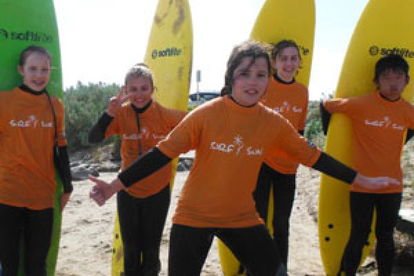 kids engage in surf lessons activities