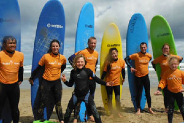 surfers posing with surf boards for surf lessons australia